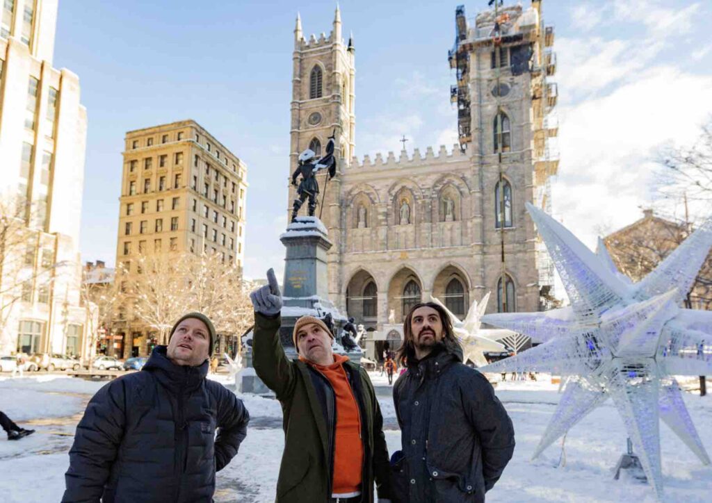 Guide pointing a landmark in Old Montreal